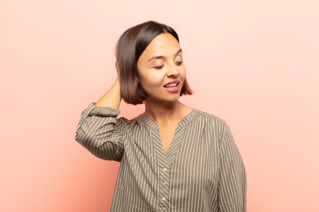 Young woman smiling cheerfully and casually