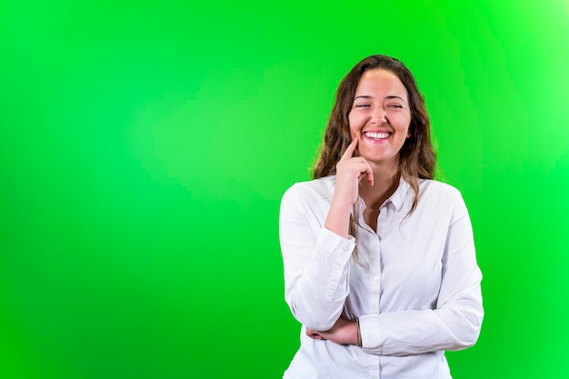 Young woman smiling green background