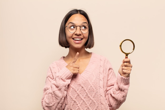 Young woman smiling happily and looking sideways