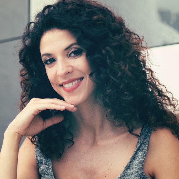 Young woman smiling at home