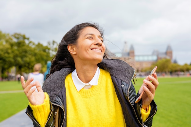 Young woman smiling in the park