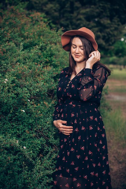 Young woman smiling while standing on field