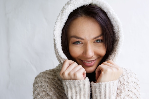 Young woman smiling with sweater