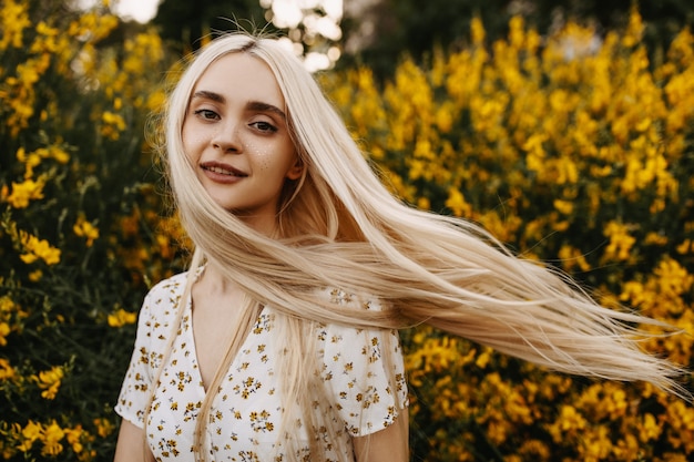 Young woman smiling with wind in her hair