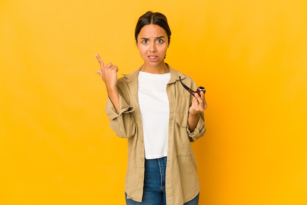 Young woman smoking on pipe