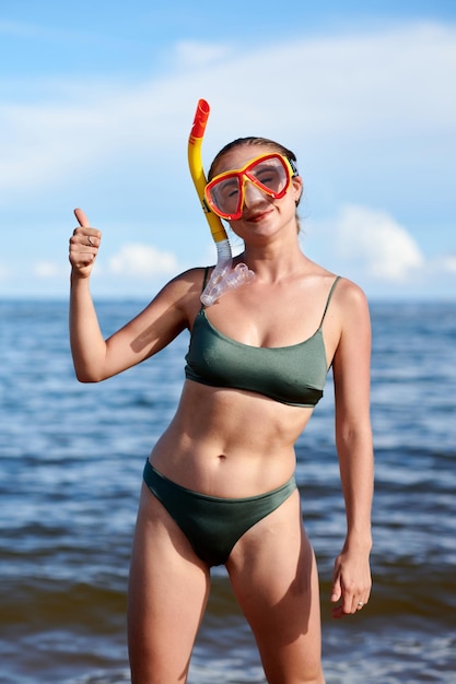 Young Woman Snorkeling in Sea