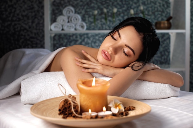 Young woman in spa salon.