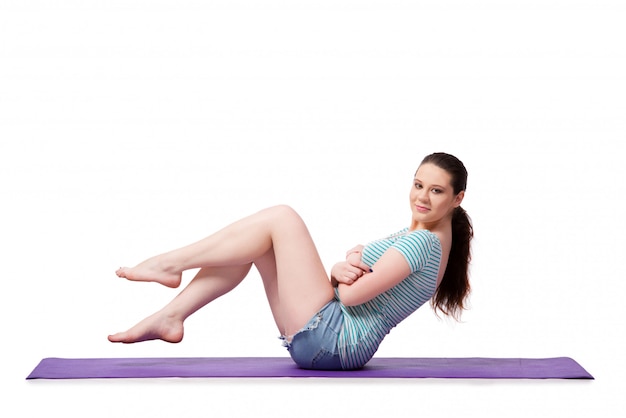 Young woman in sports concept isolated on the white