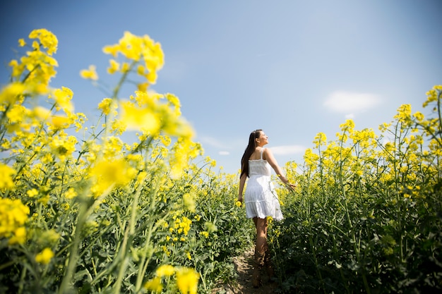 Young woman in the spring field