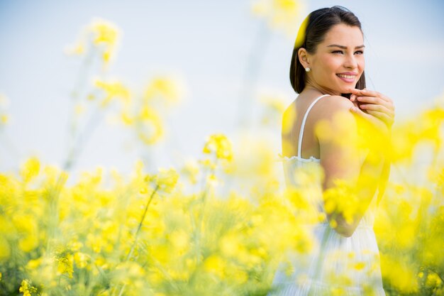 Young woman in the spring field