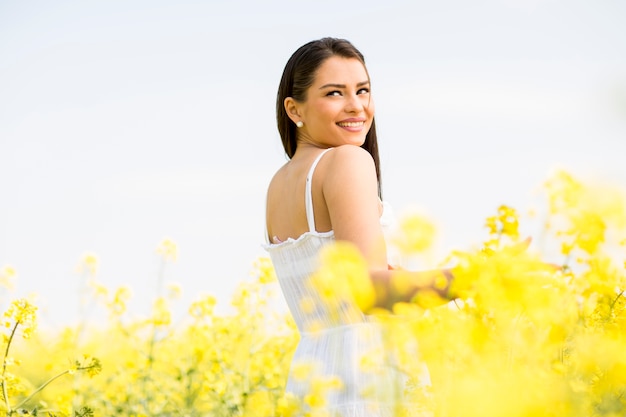 Young woman in the spring field