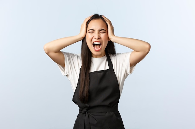 Young woman standing against white background