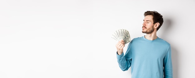 Young woman standing against white background