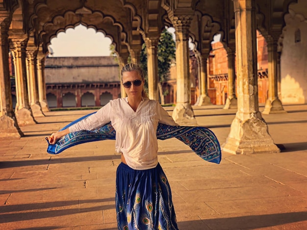 Photo young woman standing in historic building