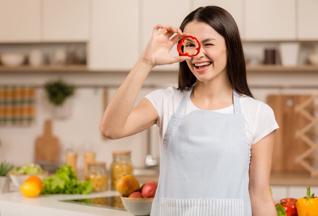 Young woman standing in the kitchen