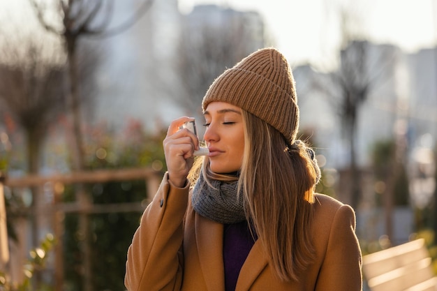 Young woman standing at street she blocked asthma atack