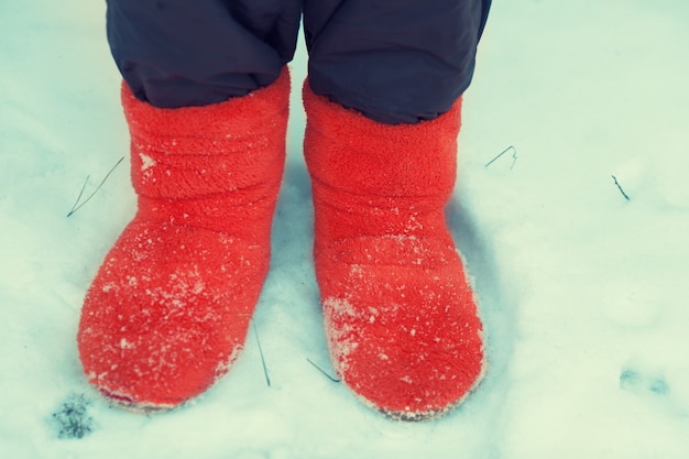 Young woman staying in the snow