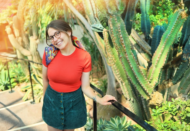 Young woman student in a botanical garden