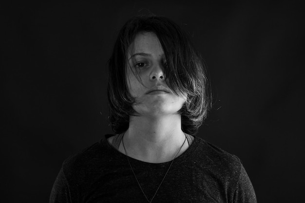 Young woman in studio black and white photo