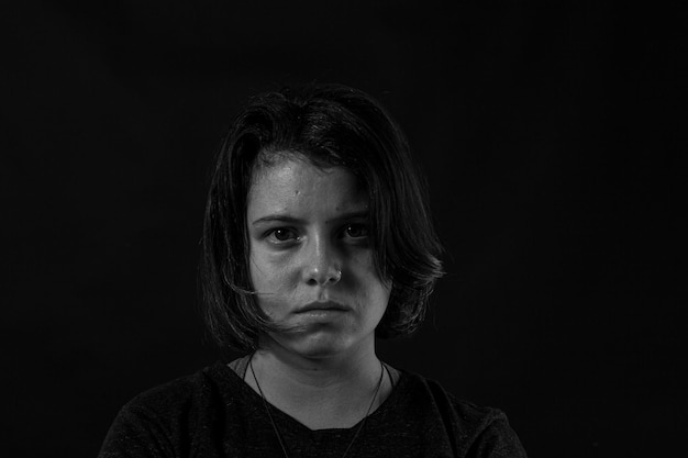 Young woman in studio black and white photo