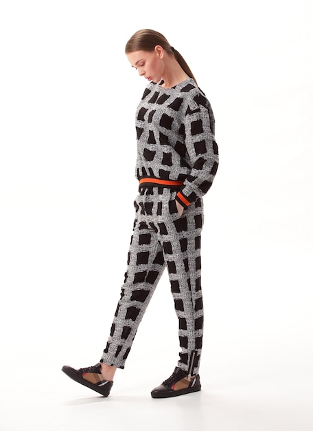 Young woman in stylish pajamasisolated on white