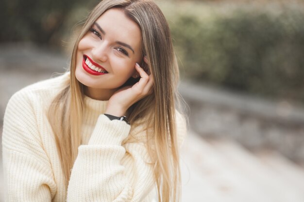 Young woman in stylish sweater