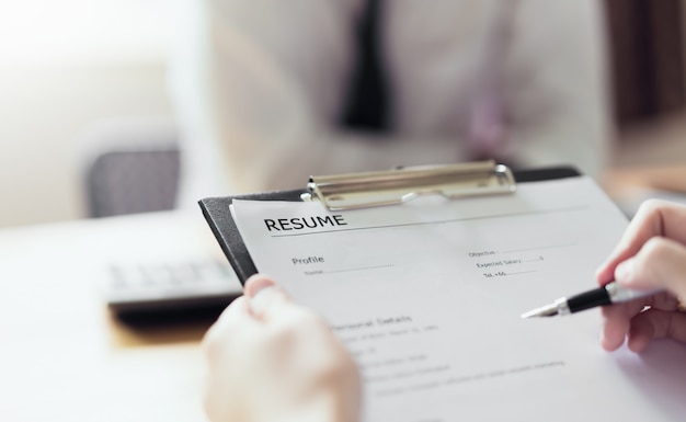 young woman submit resume employer to review job application.