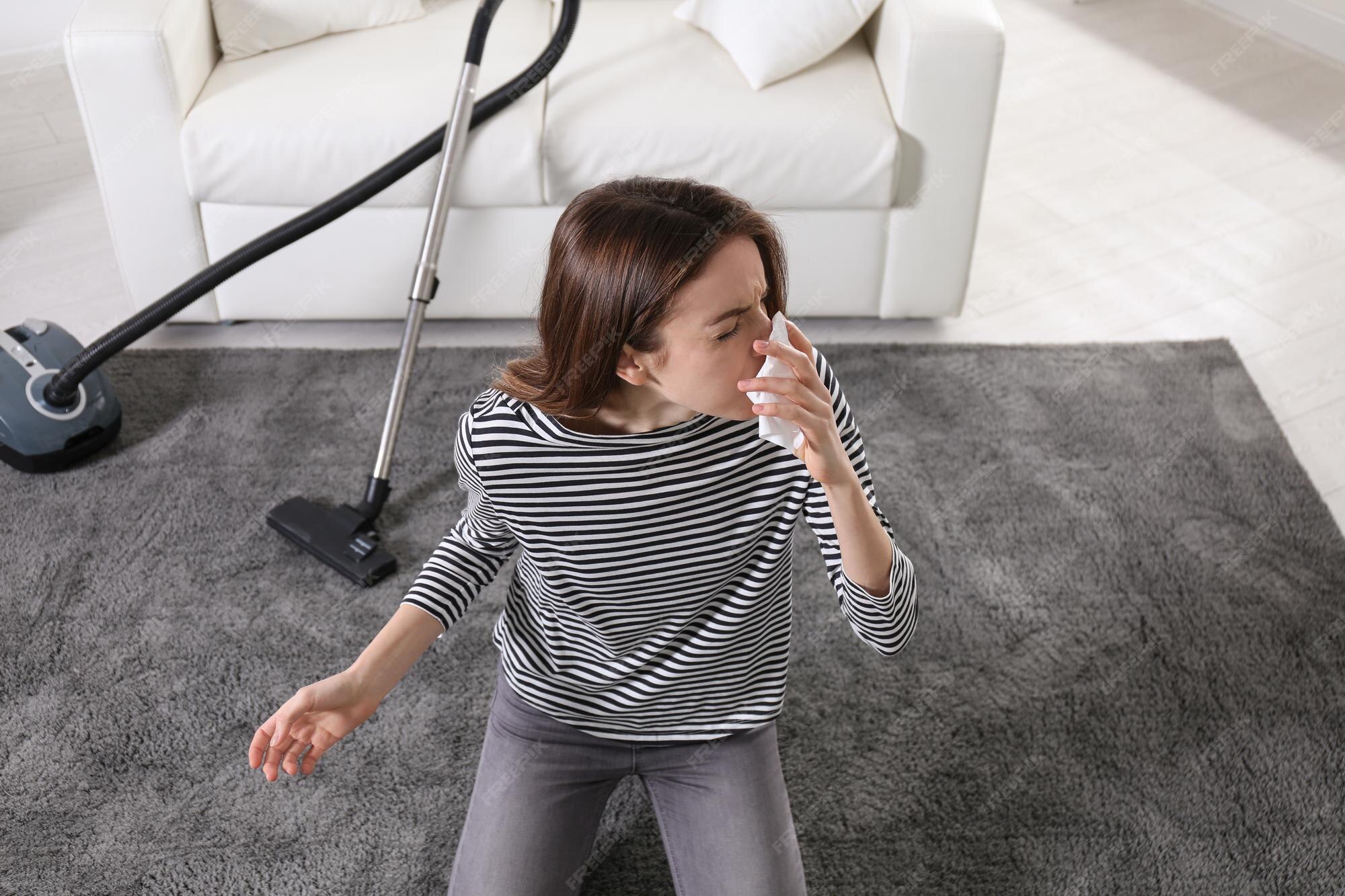 Premium Photo Young woman suffering from dust allergy while vacuuming
