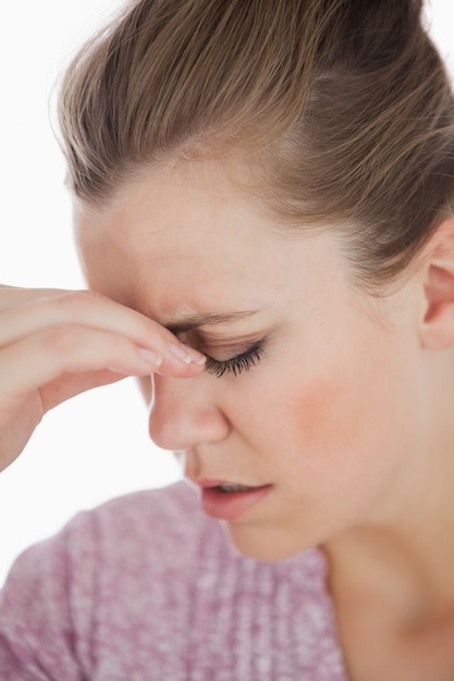 Young woman suffering from headache