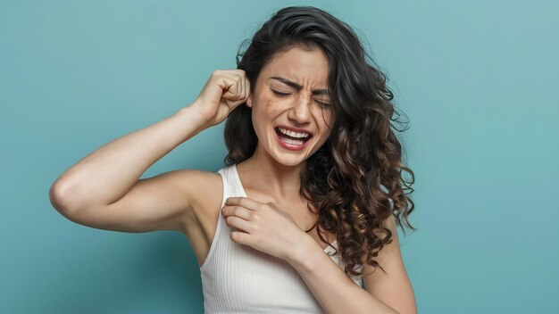 Young woman suffering from itching on her skin and scratching an itchy place