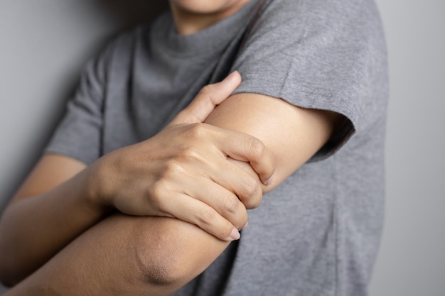 Young woman suffering from a pain