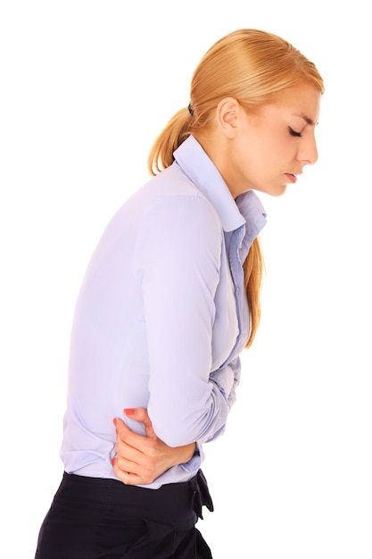 a young woman suffering from stomachache over white background