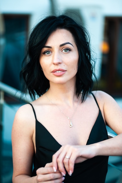 young woman in summer in a  black dress