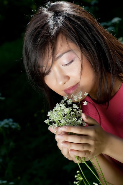 Young woman in the summer garden