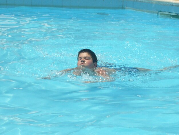 Young woman swimming in pool