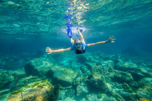 Young woman swimming in sea