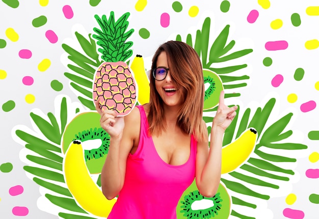 young woman in swimsuit and eyeglasses with pineapple