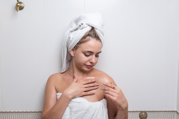 A young woman takes a bath and takes care of her skin