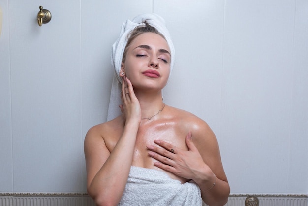 A young woman takes a bath and takes care of her skin