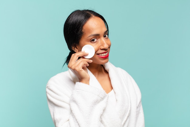 Young woman taking make up off