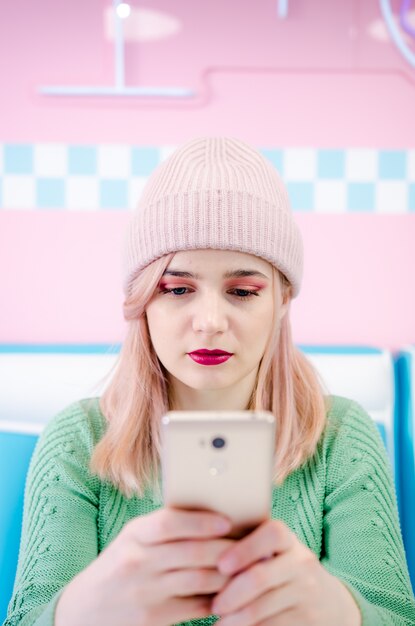 Young woman taking selfie with phone