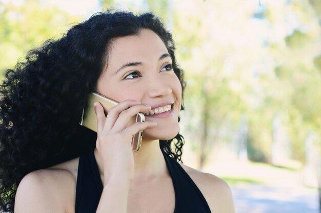 Young woman talking on her mobile phone.