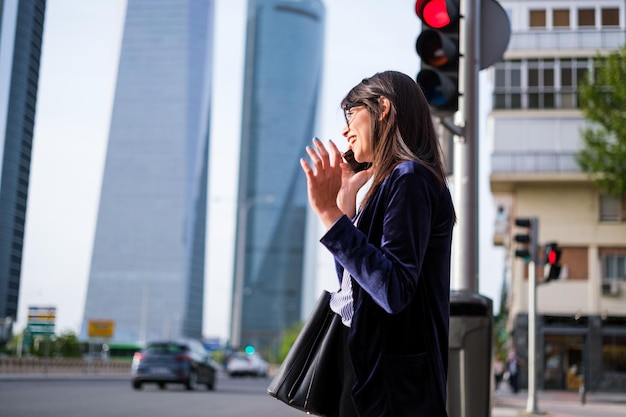 Young woman talking on the phone after work