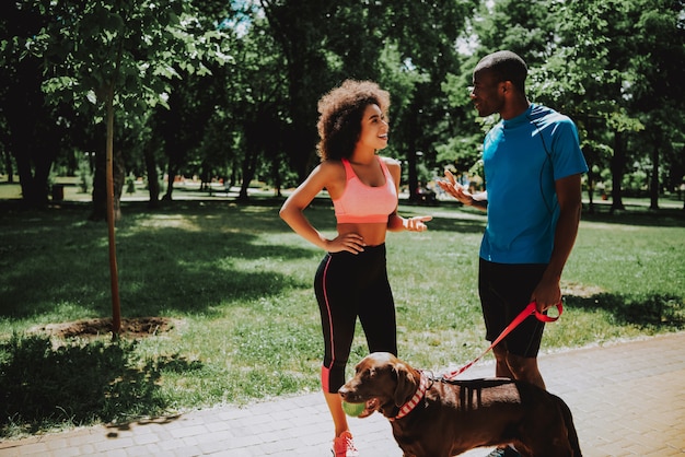 Young Woman Talking with Sporty Man.