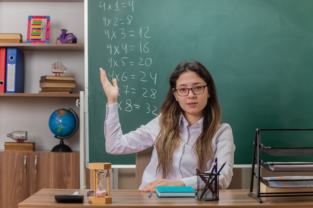 young woman teacher wearing glasses