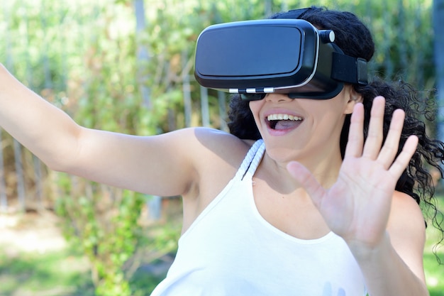 Young woman testing VR glasses.