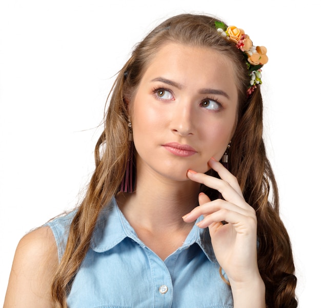 Young woman in a thoughtful pose