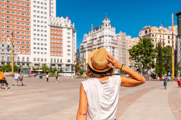 Young woman tourist in Plaza Espana in the center of the capital of Madrid