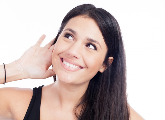 Young woman trying to listen something