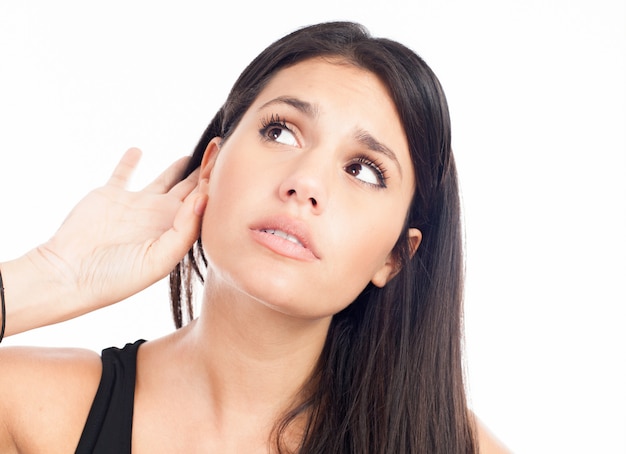 Young woman trying to listen something